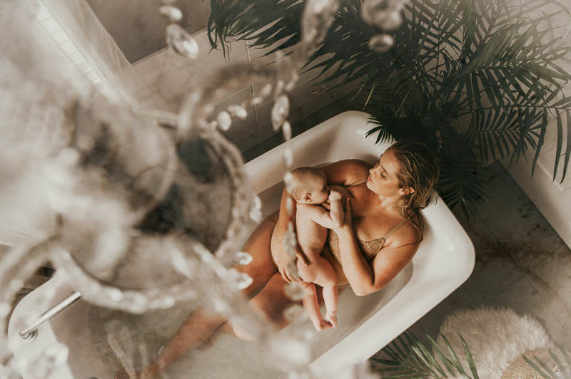 Mother Nursing Her Baby During Toronto Newborn Photography Session