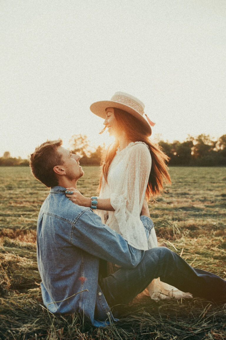 fun western couples photography in a hay field
