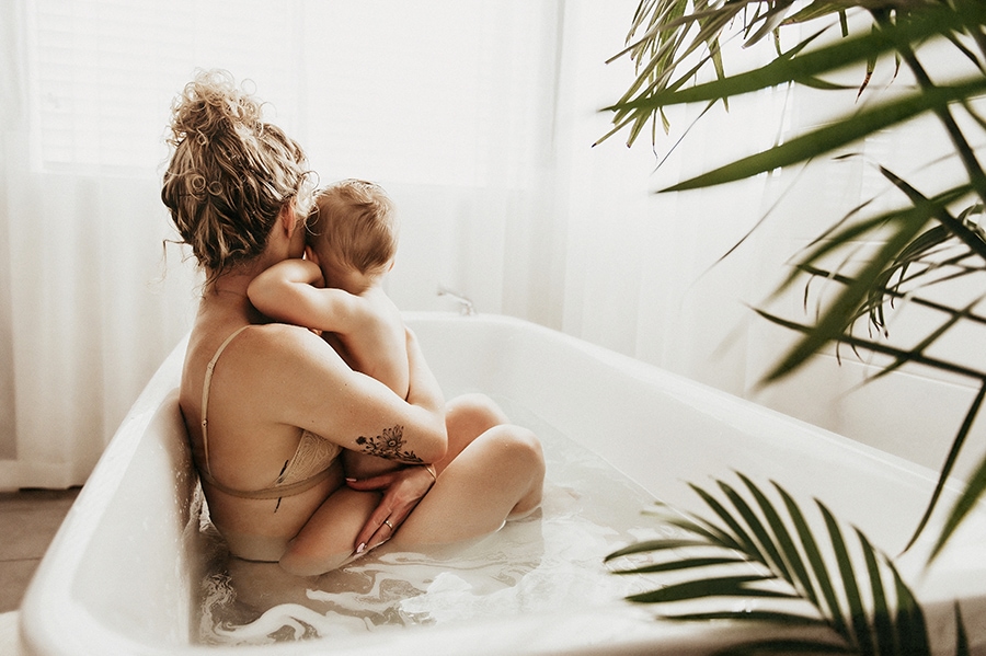 Baby Boy Resting on His Mother During a Bath Time Photo Shoot